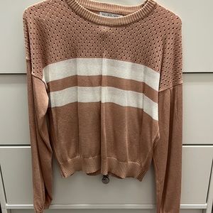 Soft comfy pink sweater with two white stripes!